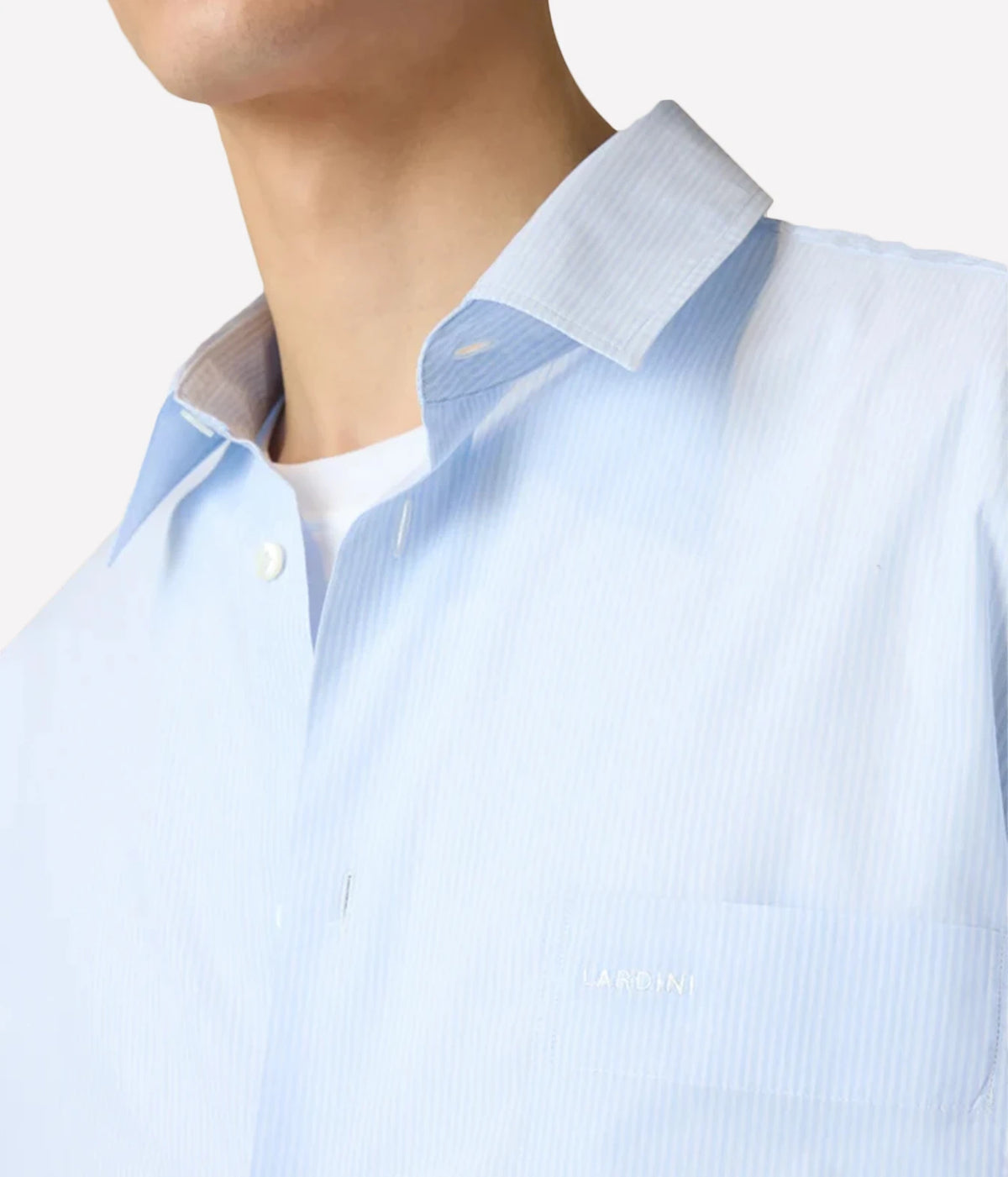 Close-up of model wearing Lardini Cotton Pocket Shirt in Blue Stripe showing the Italian collar