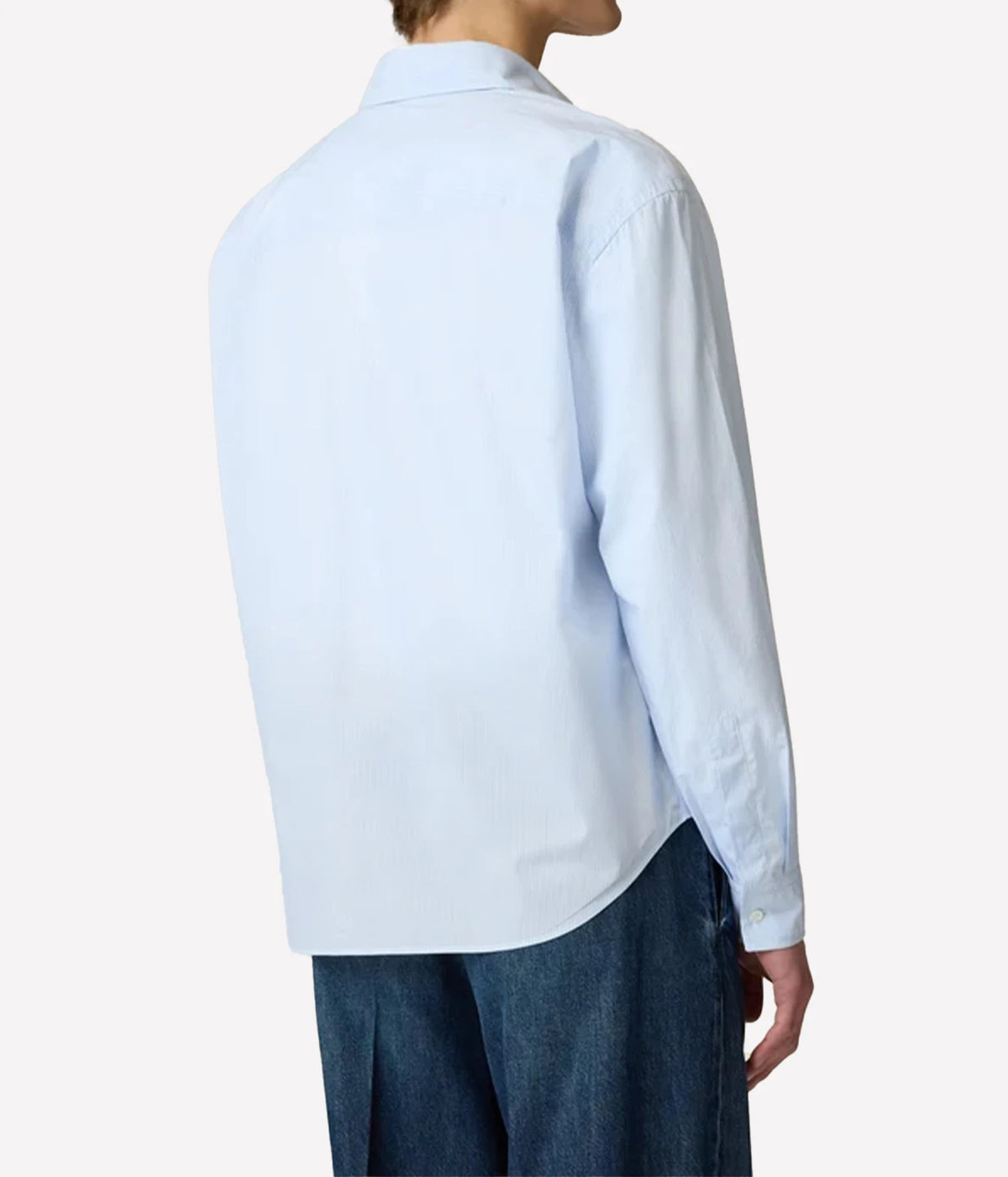 Side view of model wearing Lardini Cotton Pocket Shirt in Blue Stripe with jeans