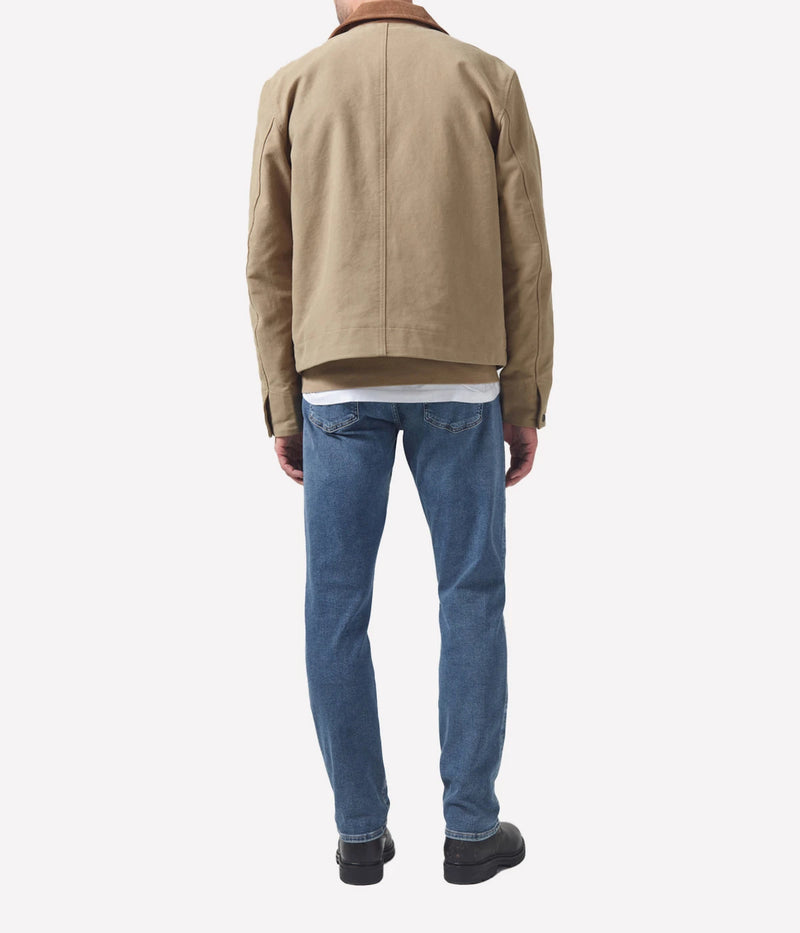 Adler Jean, designed with a low-rise waist and tapered legs. Inspired by the city's rock scene, this streamlined pair features a minimalist design, free of unnecessary embellishments. Crafted from a blend of lyocell, organic cotton, modal, polyester, and elastane for a comfortable, flexible fit.
