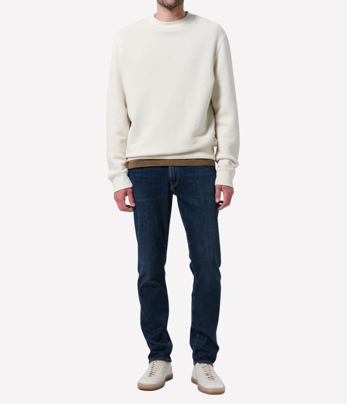 Men’s slim straight dark indigo jeans with subtle fading and whiskering, featuring a tailored fit and lightweight stretch denim made from regenerative cotton.