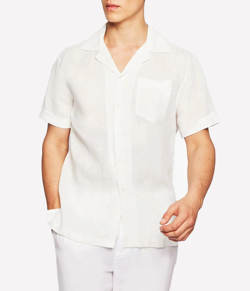 A relaxed-fit Angelo Shirt by Frescobol Carioca in lightweight Italian linen. Features a camp collar, chest pocket, and breathable fabric for effortless warm-weather style. Made in Portugal.