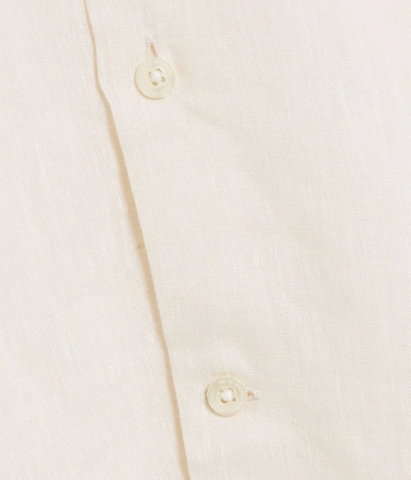 Close-up of the Antonio Long Sleeve Linen Shirt by Frescobol Carioca, crafted from premium fine Italian linen. The smooth texture and lightweight feel of the fabric ensure comfort and elegance, enhanced by imitation mother of pearl buttons for a sophisticated finish.