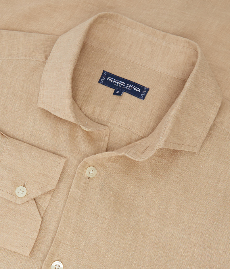 the Antonio Long Sleeve Linen Shirt by Frescobol Carioca, floating to emphasize its structured dress collar with stiffeners, imitation mother of pearl buttons, and full placket. The lightweight Italian linen construction ensures breathable comfort and elevated style for versatile occasion dressing