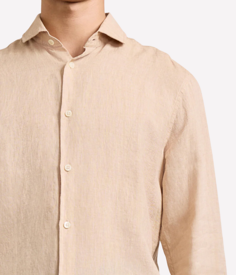 the Antonio Long Sleeve Linen Shirt by Frescobol Carioca, floating to emphasize its structured dress collar with stiffeners, imitation mother of pearl buttons, and full placket. The lightweight Italian linen construction ensures breathable comfort and elevated style for versatile occasion dressing