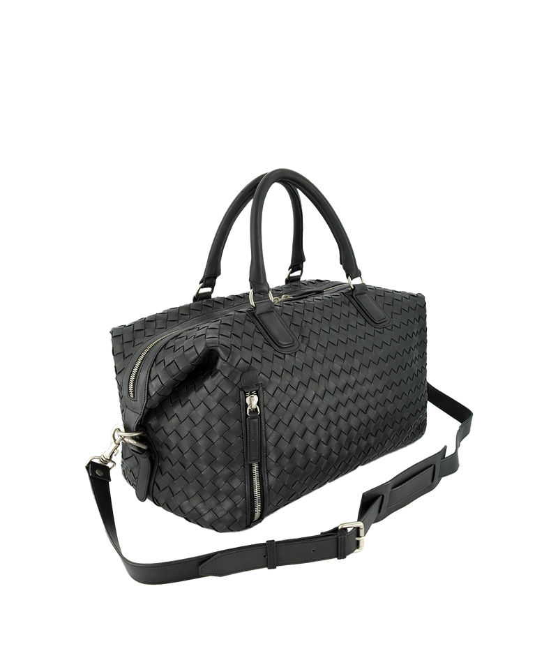 Leather Armor 019 Travel Bag with top handles, adjustable shoulder strap, side buckles, and side zipper pocket for travel essentials.