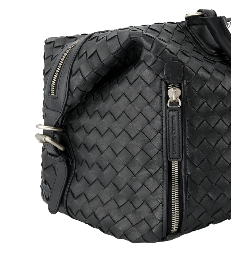 Leather Armor 019 Travel Bag with top handles, adjustable shoulder strap, side buckles, and side zipper pocket for travel essentials.