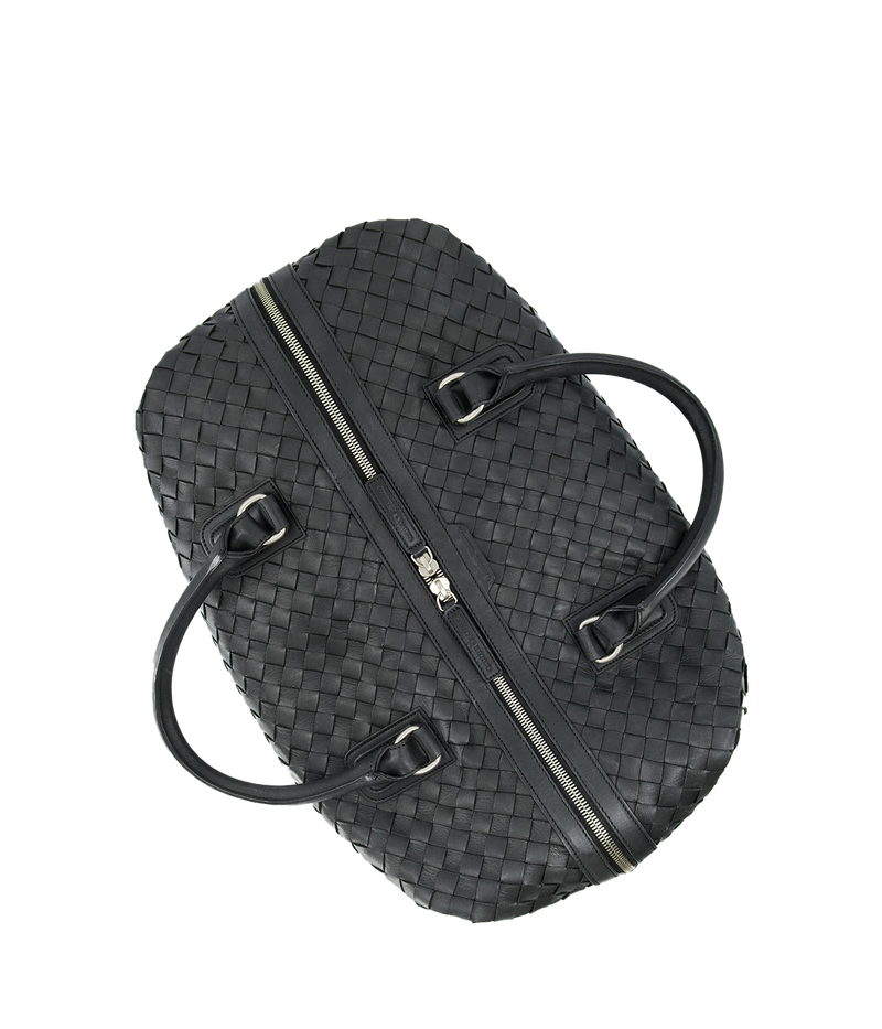 Leather Armor 019 Travel Bag with top handles, adjustable shoulder strap, side buckles, and side zipper pocket for travel essentials.