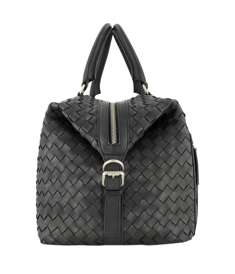 Leather Armor 019 Travel Bag with top handles, adjustable shoulder strap, side buckles, and side zipper pocket for travel essentials.