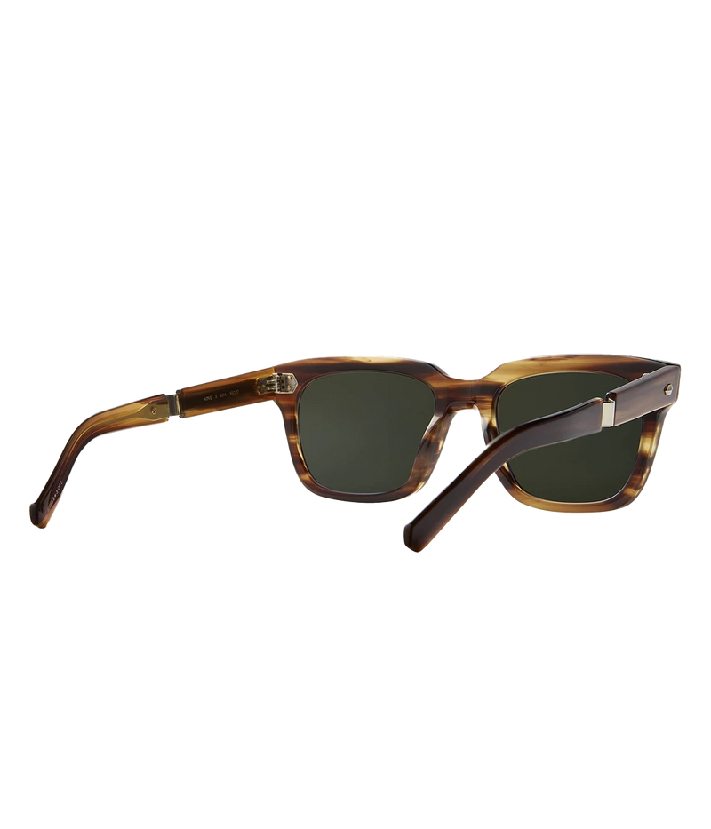 A modern take on a country club classic, the Arnie sunglasses by Mr Light feature a sleek acetate frame with titanium components and intricate filigree at the temples. Handcrafted in Japan with optical-quality CR39 lenses for superior clarity and UV protection.