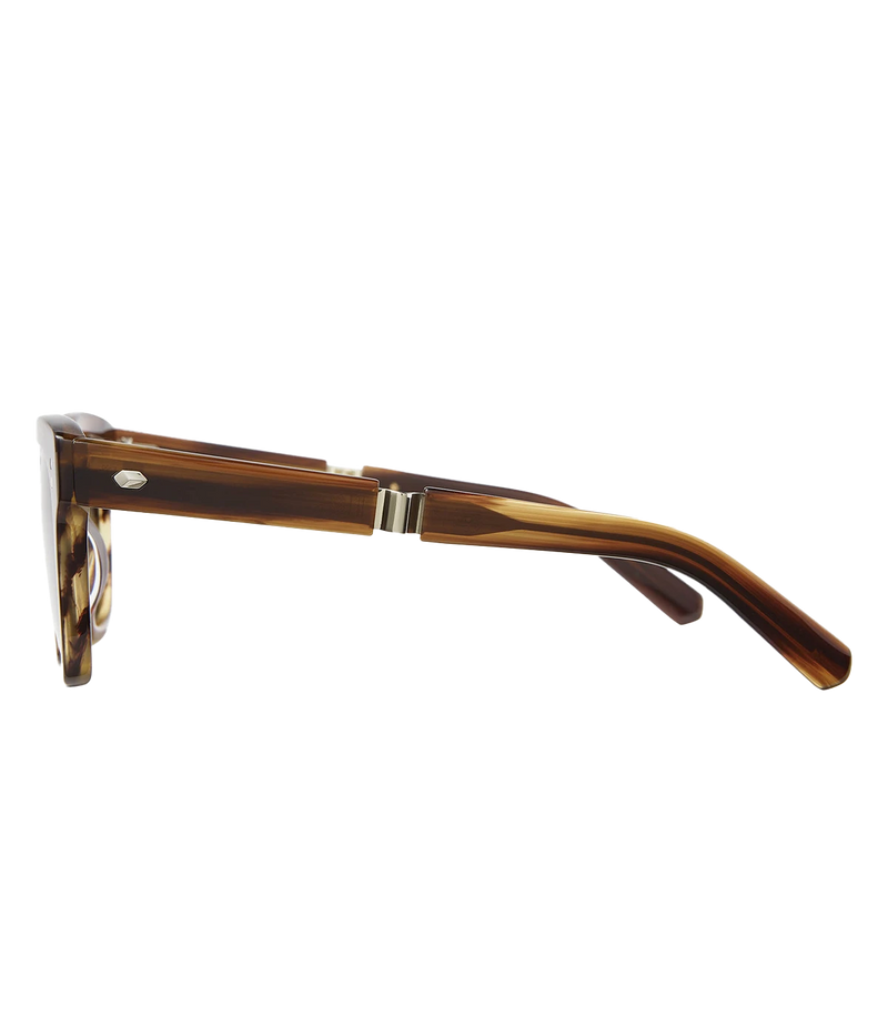 A modern take on a country club classic, the Arnie sunglasses by Mr Light feature a sleek acetate frame with titanium components and intricate filigree at the temples. Handcrafted in Japan with optical-quality CR39 lenses for superior clarity and UV protection.