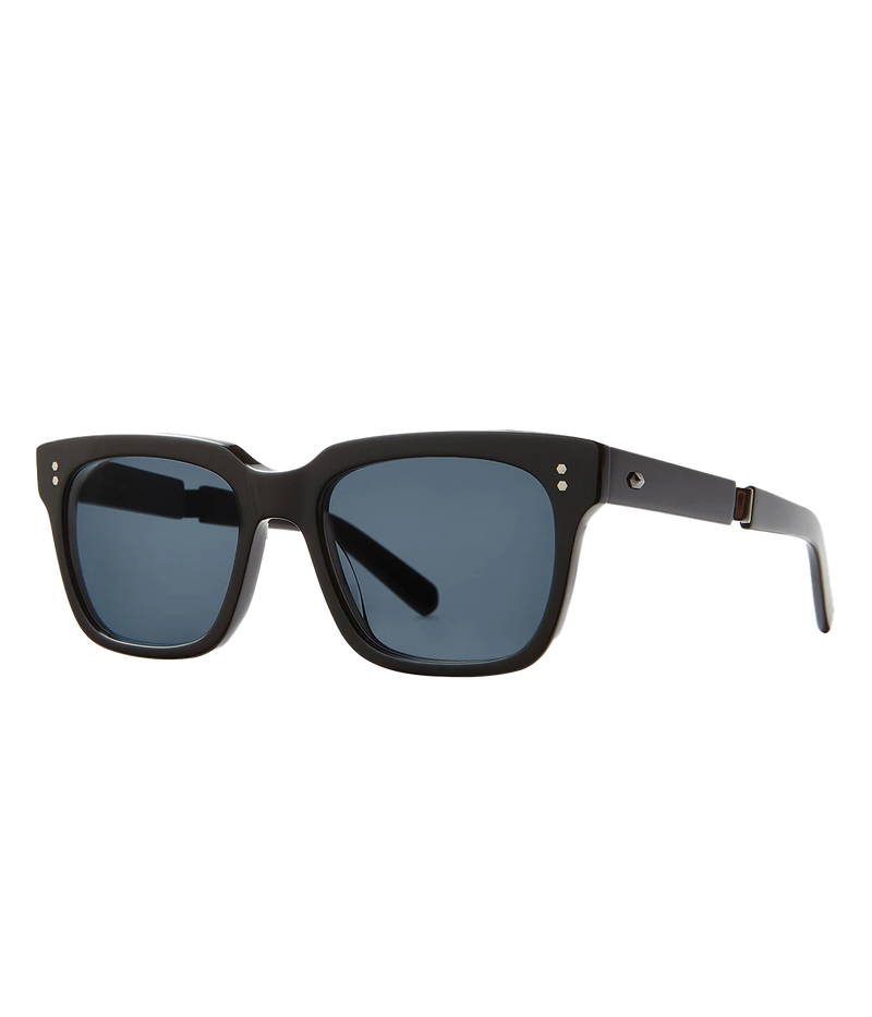 A modern take on a country club classic, the Arnie sunglasses by Mr Light feature a sleek acetate frame with titanium components and intricate filigree at the temples. Handcrafted in Japan with optical-quality CR39 lenses for superior clarity and UV protection.