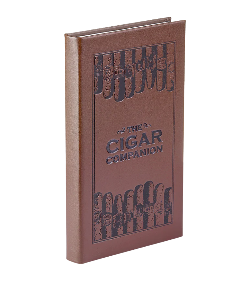 Luxury guide to handmade cigars, featuring 224 pages on cigar history, brands, and tasting techniques with full-colour photography.