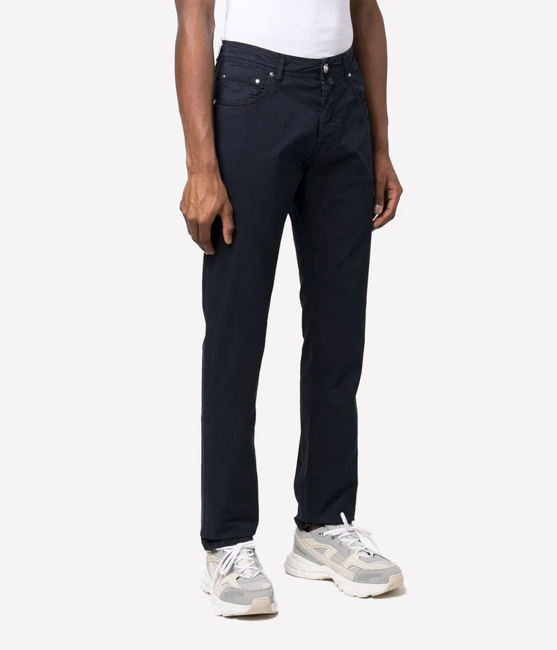 Bard 5-Pocket Jean by Jacob Cohen in a navy blue wash, featuring a mid-rise, slim fit and crafted from premium stretch denim. Designed with a five-pocket style, branded hardware, and an iconic suede patch, these jeans combine luxury with versatility for everyday sophistication.