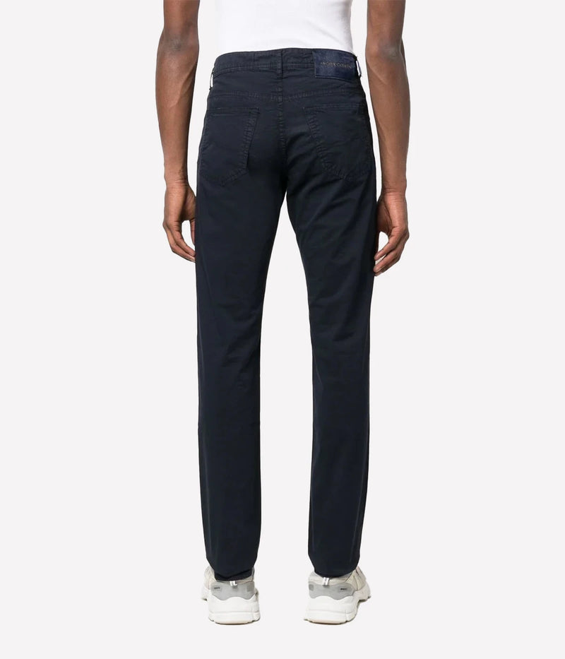 Bard 5-Pocket Jean by Jacob Cohen in a navy blue wash, featuring a mid-rise, slim fit and crafted from premium stretch denim. Designed with a five-pocket style, branded hardware, and an iconic suede patch, these jeans combine luxury with versatility for everyday sophistication.