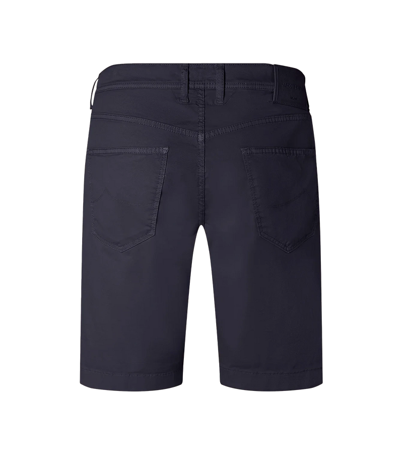 Rear view of dark navy blue denim shorts showing the back pockets, belt loops, and button closure on a solid white background.