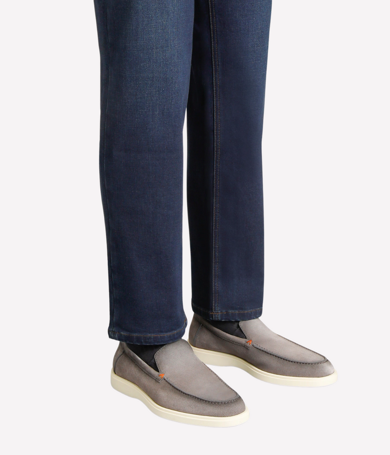 Men's grey suede Santoni loafers with apron stitching, orange detailing, and a smooth rubber sole—crafted in Italy for understated elegance.