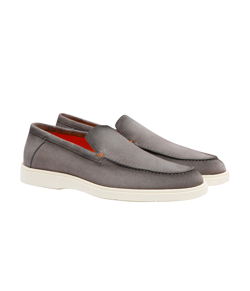 Men's grey suede Santoni loafers with apron stitching, orange detailing, and a smooth rubber sole—crafted in Italy for understated elegance.