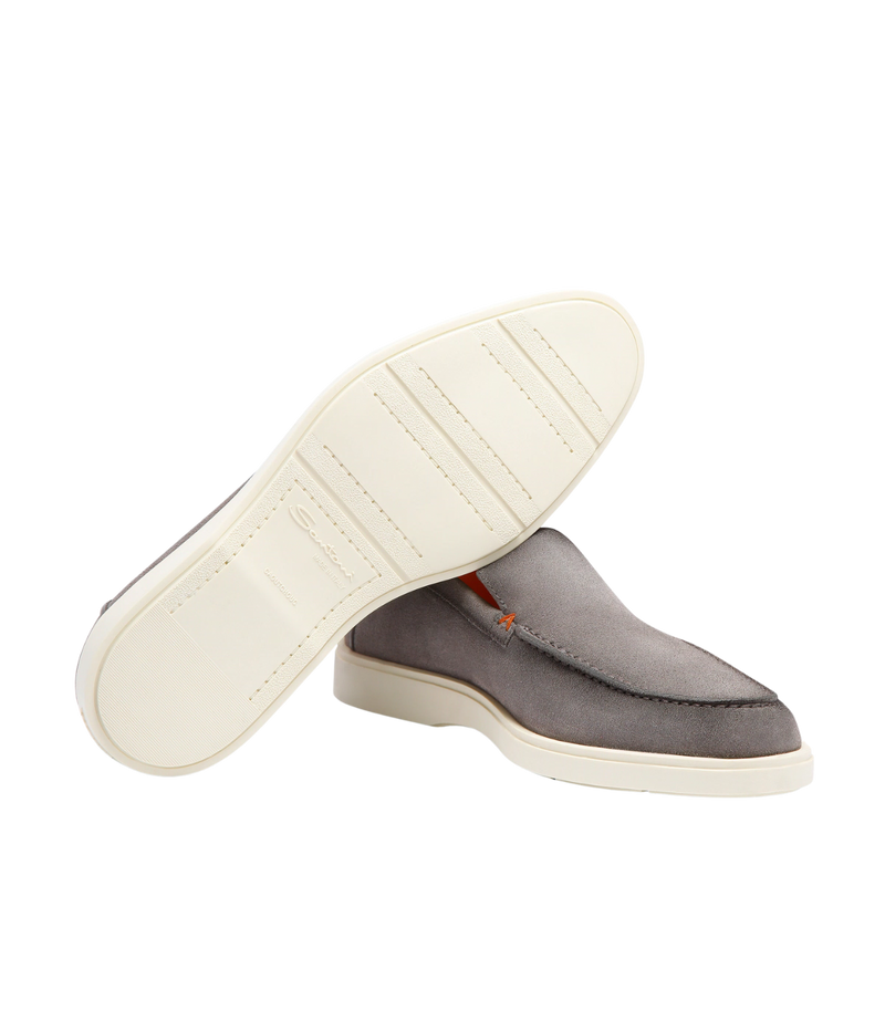Men's grey suede Santoni loafers with apron stitching, orange detailing, and a smooth rubber sole—crafted in Italy for understated elegance.