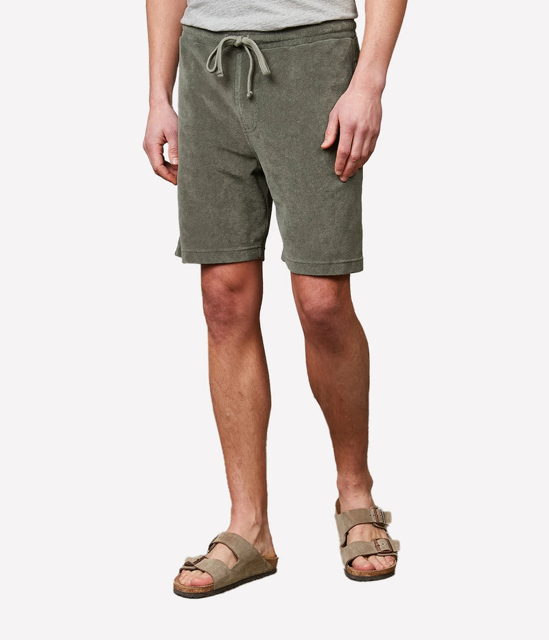 Military green Bouclette Bermuda shorts made from soft cotton terry towelling, featuring a drawstring waist and side pockets for casual comfort