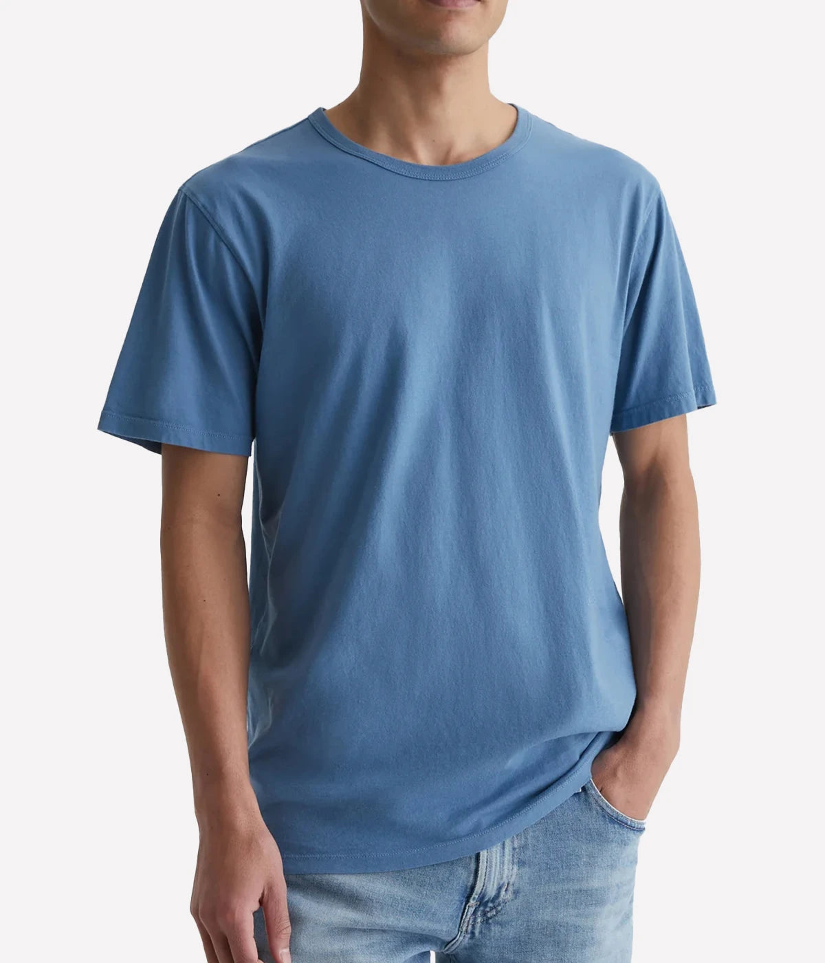 A model wearing the AG Bryce Crew Neck T-Shirt in crystal blue, featuring short sleeves and a classic crew neck design, made from 100% cotton for a soft and relaxed fit.