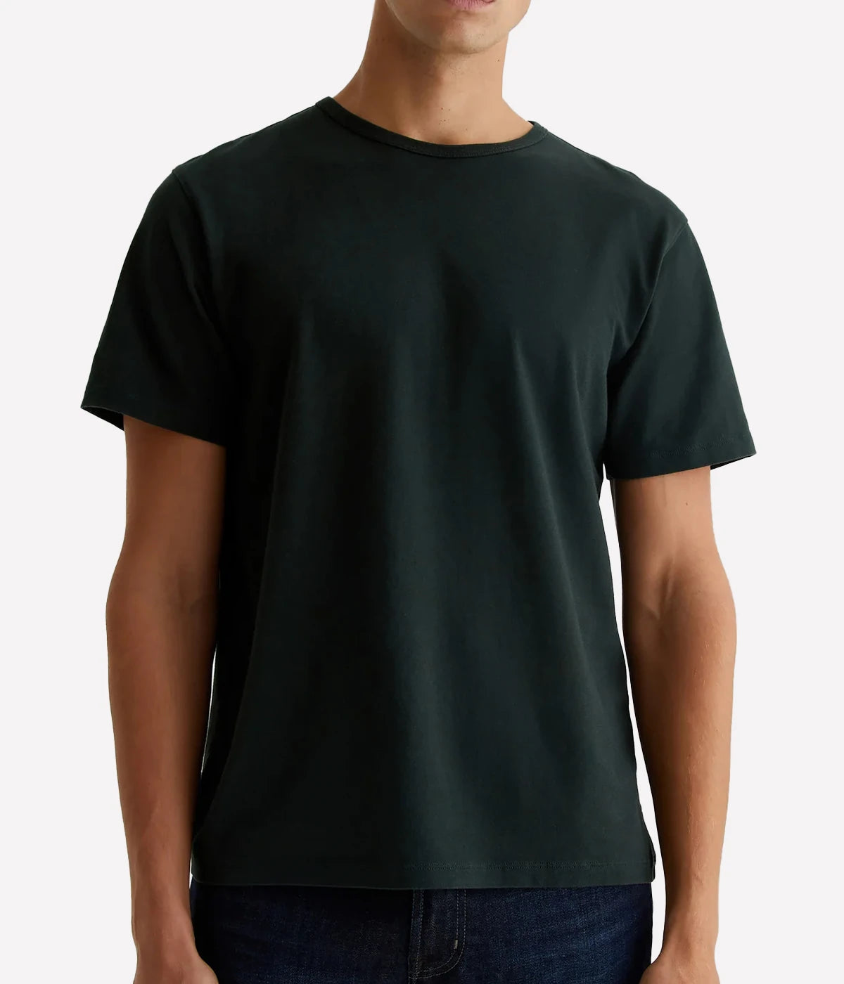 A model wearing the AG Bryce Crew Neck T-Shirt in hidden pine, featuring short sleeves and a classic crew neck design, made from 100% cotton for a soft and relaxed fit.