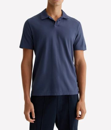 In a timeless blue shade, the Bryce Johnny Collar shirt is a classic short-sleeve polo tee with a relaxed neckline and pointed collar. Cut from 100% cotton, this soft and easy to wash & wear shirt is the perfect hybrid between a polo and t-shirt.  