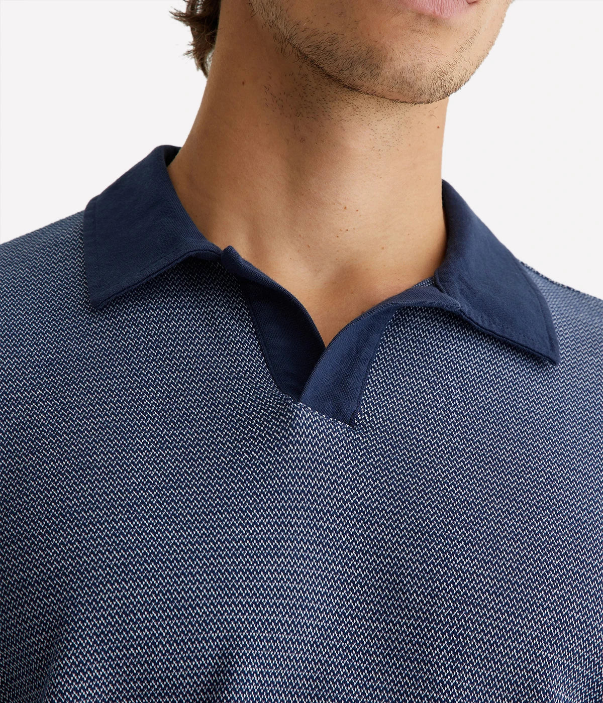 Close-up of the Bryce Johnny Collar polo shirt, focusing on the finely crafted collar and soft texture of the cotton fabric.