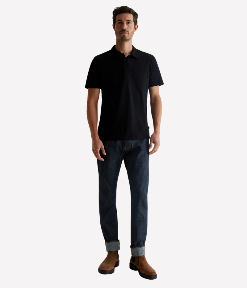 Model wearing the AG Bryce Johnny Collar Polo Shirt, featuring a pointed collar, relaxed neckline, and soft cotton jersey fabric. The lightweight material and timeless design make it a perfect pairing with jeans or tailored pieces.