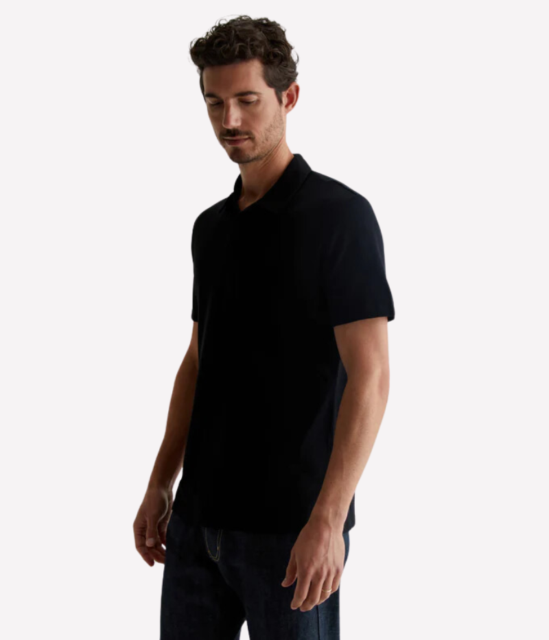 Model wearing the AG Bryce Johnny Collar Polo Shirt, featuring a pointed collar, relaxed neckline, and soft cotton jersey fabric. The lightweight material and timeless design make it a perfect pairing with jeans or tailored pieces.