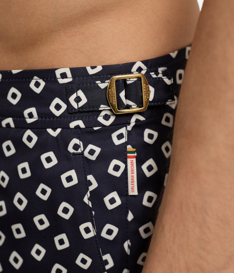 Men’s Bulldog tailored swim shorts in quick-drying recycled polyester with adjustable gold-effect side fasteners and concealed snap closure, designed for versatile wear.