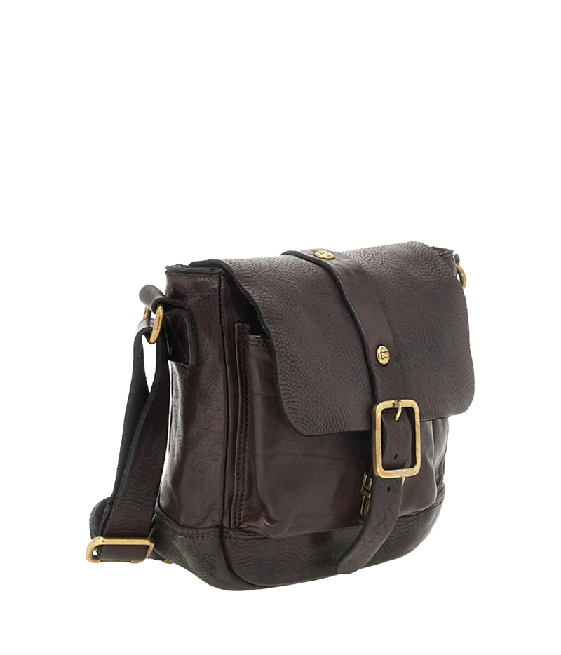 Three-quarter view of Campomaggi Spino Small Crossbody Bag in Brown with the leather crossbody strap