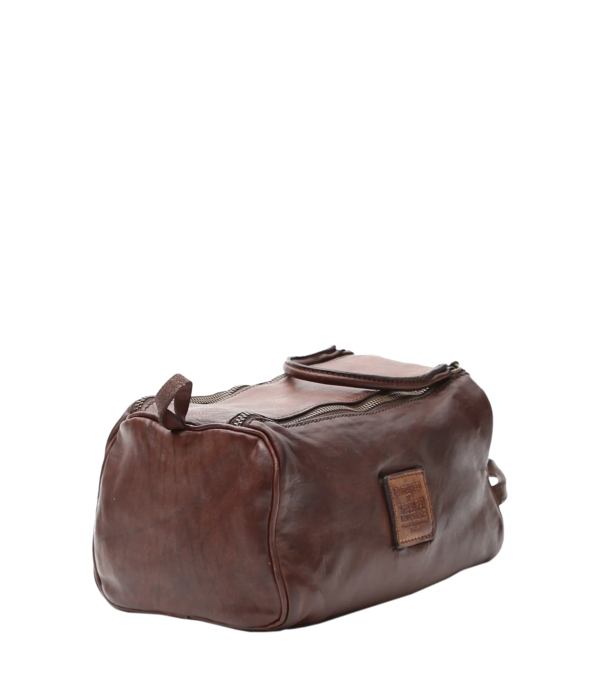Three-quarter view of Campomaggi Leather Toiletries Bag in Brown showing the leather logo tab