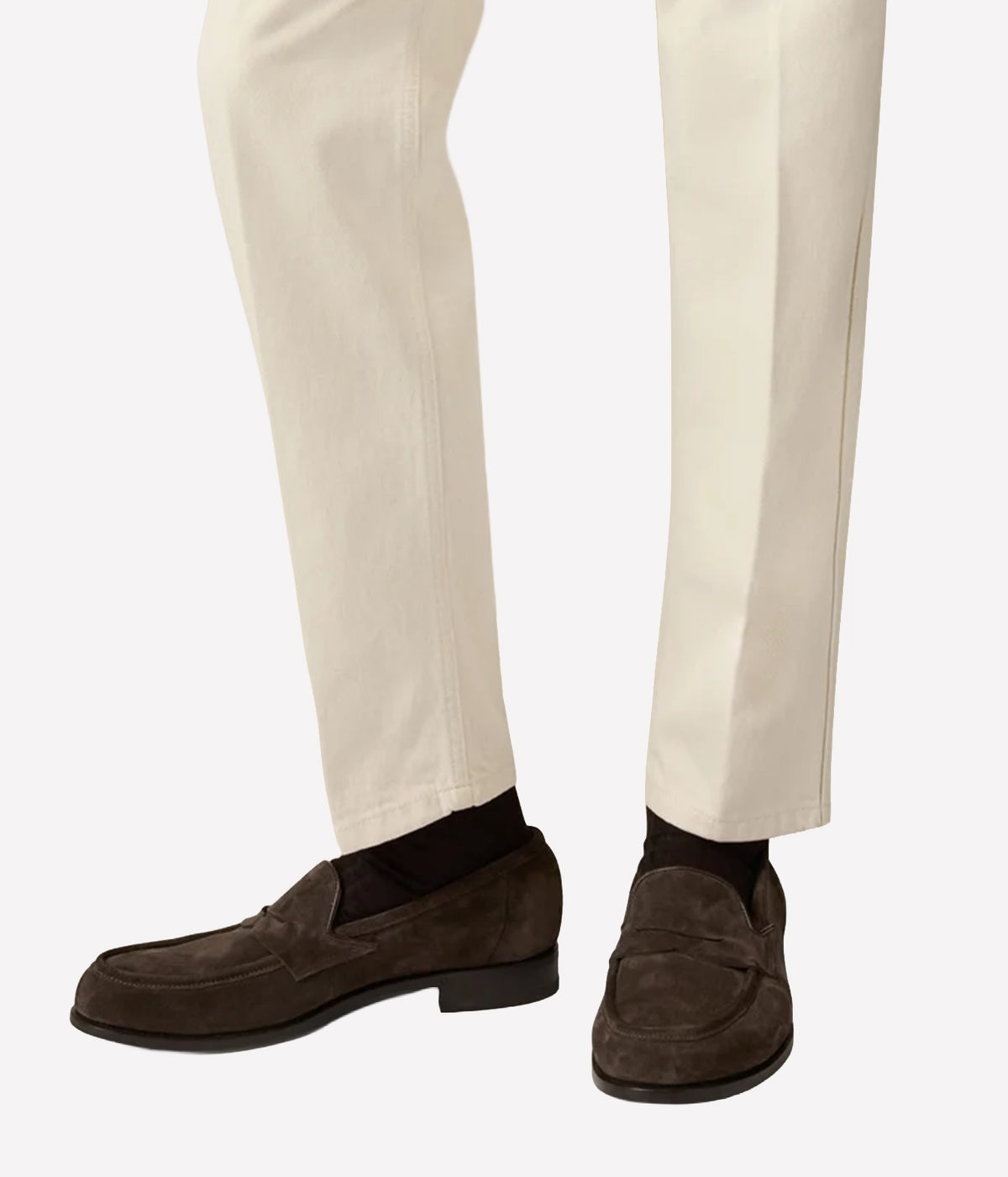 Man wearing Lardini Calf Suede Loafers in Brown with cream trousers, side view