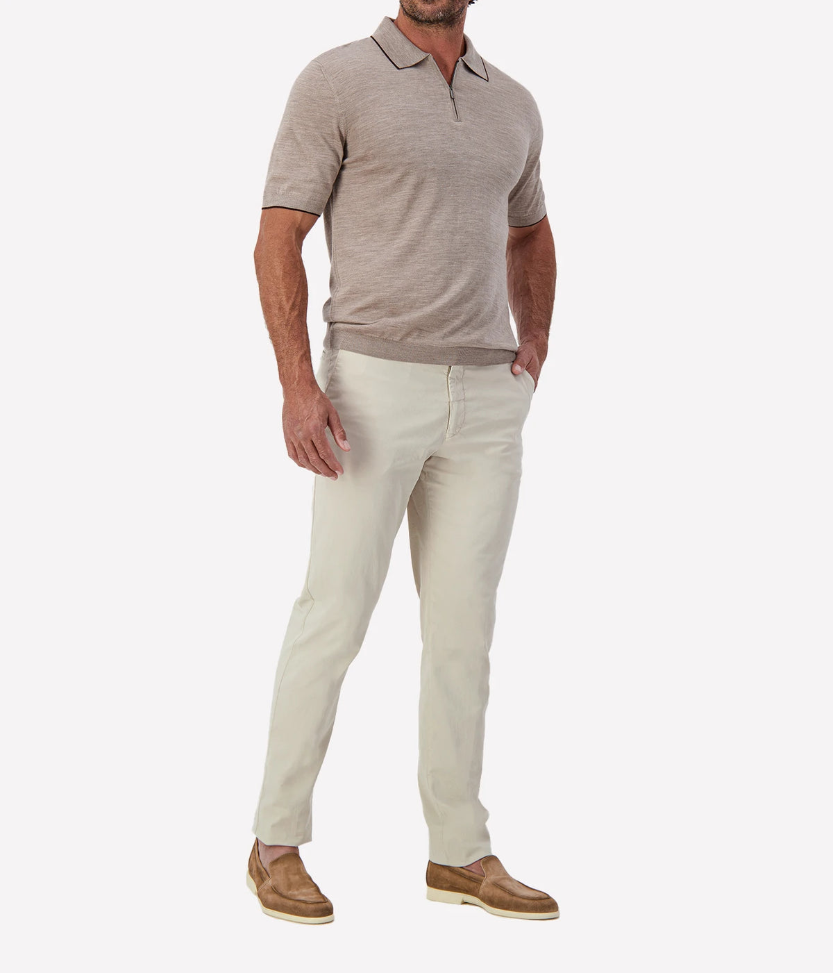 Man wearing Maurizio Baldassari Fine Wool Zip Polo in Beige with stone trousers and tan loafers, three-quarter view