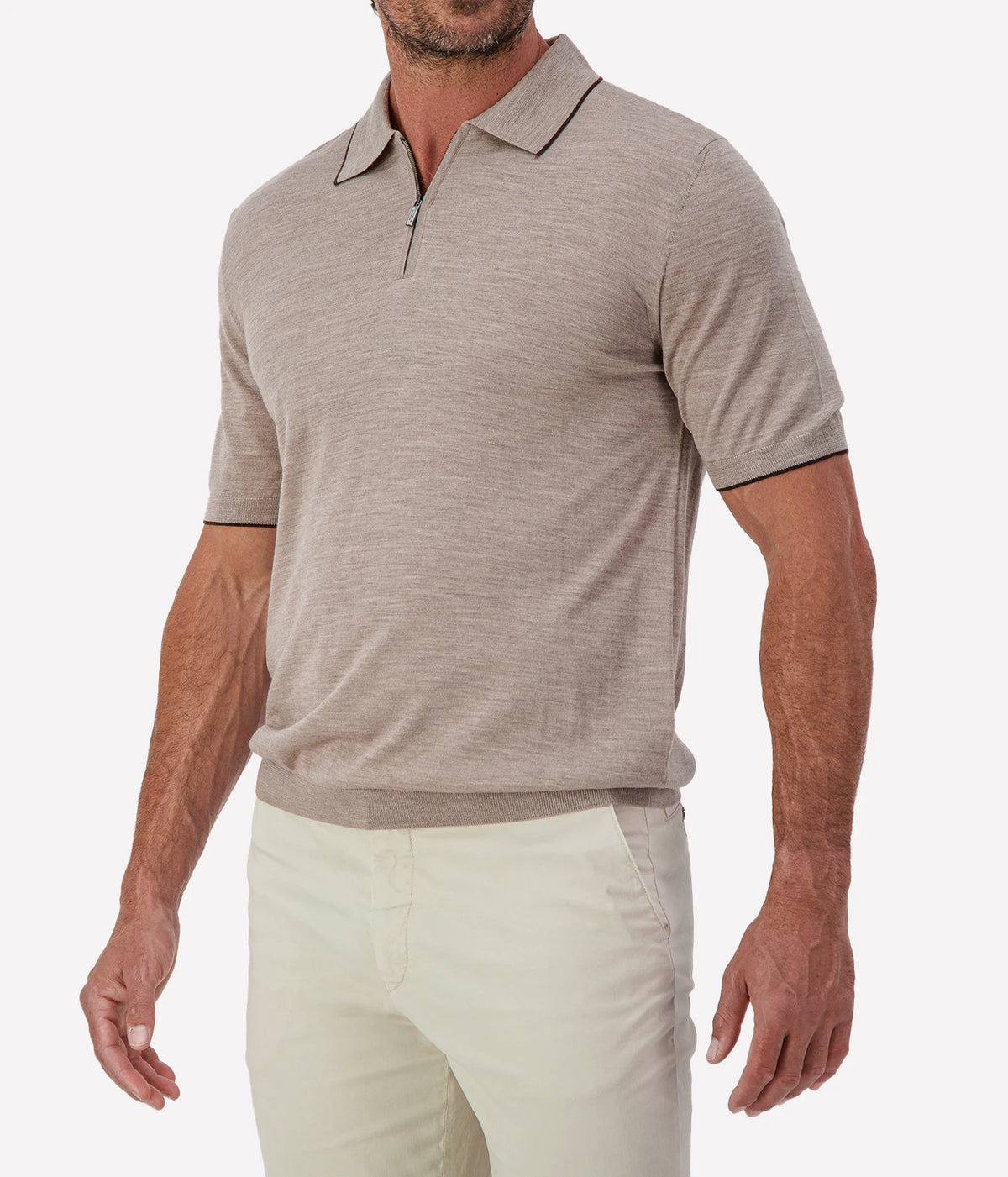 Man wearing Maurizio Baldassari Fine Wool Zip Polo in Beige with stone trousers, cropped angled front view