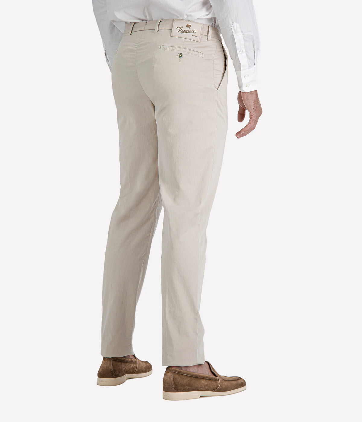 Man wearing Marco Pescarolo New York Cotton Silk Trouser in Beige with a white shirt and brown suede loafers, cropped three-quarter view
