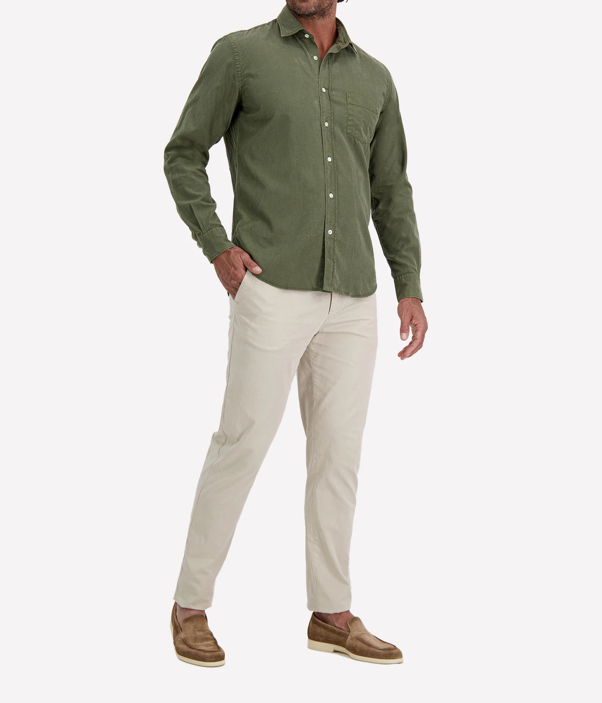 Man wearing Hartford Paul Tencel & Cotton Shirt in Military with stone chinos and brown suede shoes, angled front view with hand in pocket