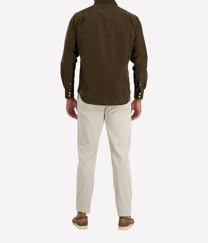 Back view of man wearing Hartford Paul Fine Corduroy Shirt in Olive with stone chinos and brown suede shoes