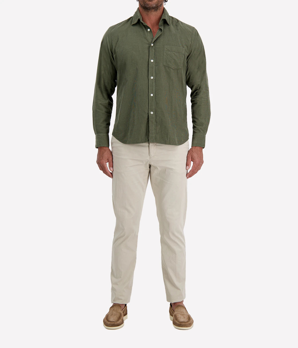 Man wearing Hartford Paul Fine Corduroy Shirt in Military with stone chinos and brown suede shoes, full-length front view