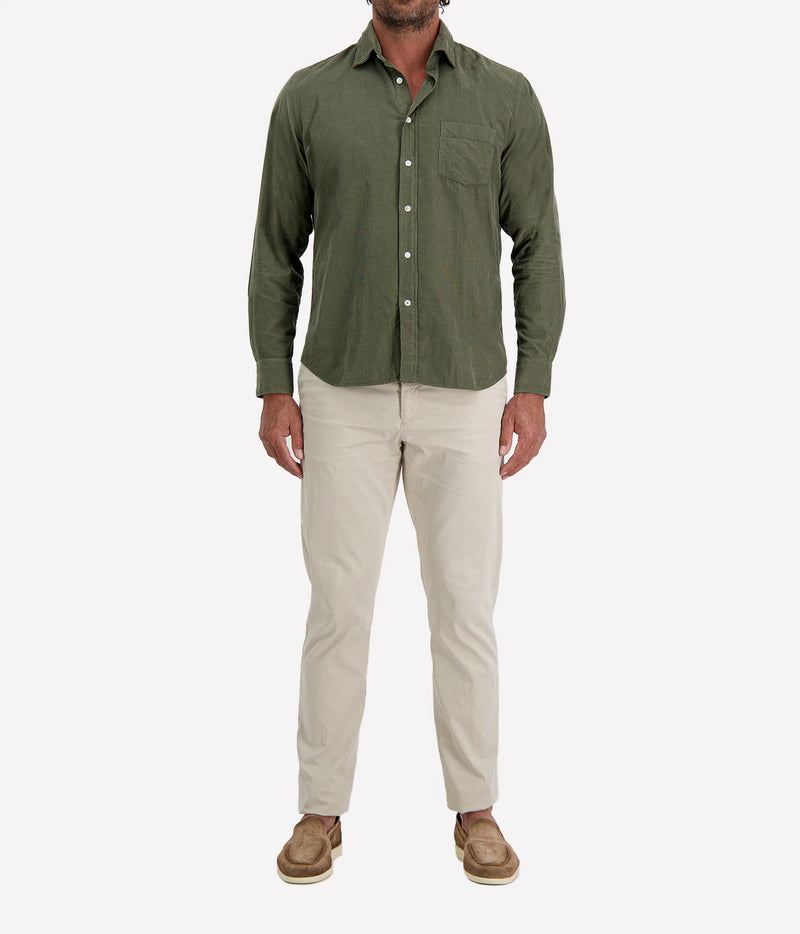 Man wearing Hartford Paul Fine Corduroy Shirt in Military with stone chinos and brown suede shoes, full-length front view