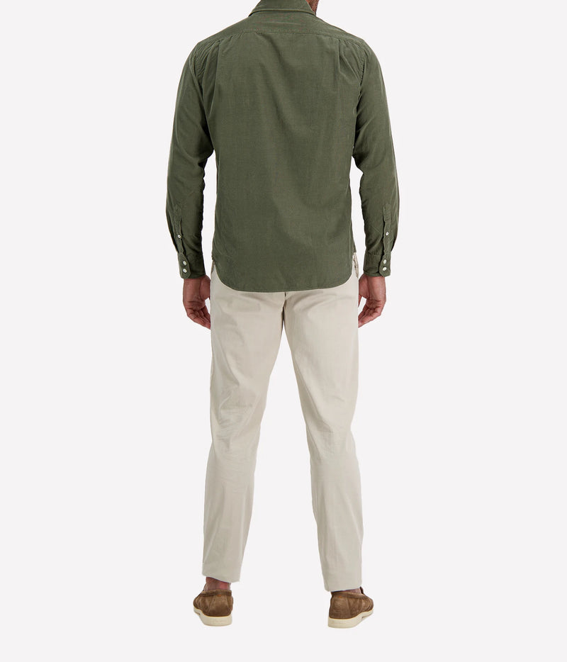Back view of man wearing Hartford Paul Fine Corduroy Shirt in Military with stone chinos and brown suede shoes