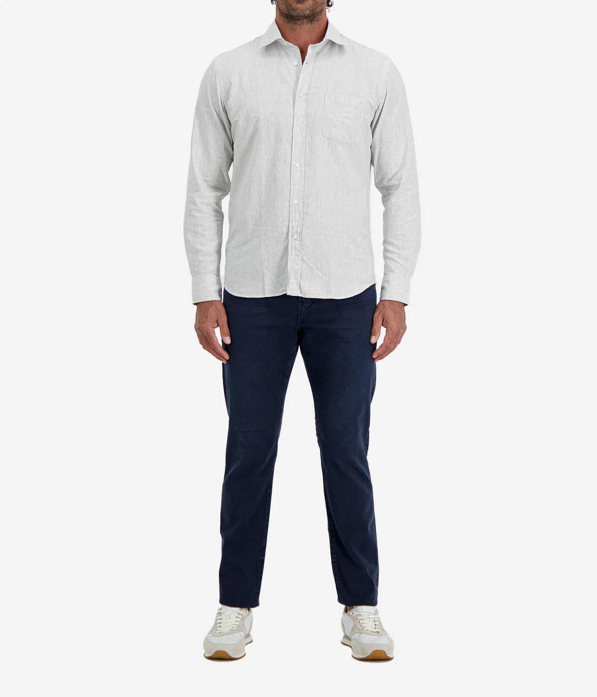 Man wearing Hartford Paul Cotton Shirt in Grey with indigo jeans and white sneakers, full-length front view