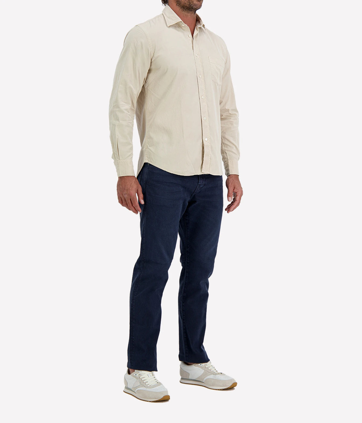 Man wearing Hartford Paul Tencel & Cotton Shirt in Stone with indigo jeans and white sneakers, three-quarter view