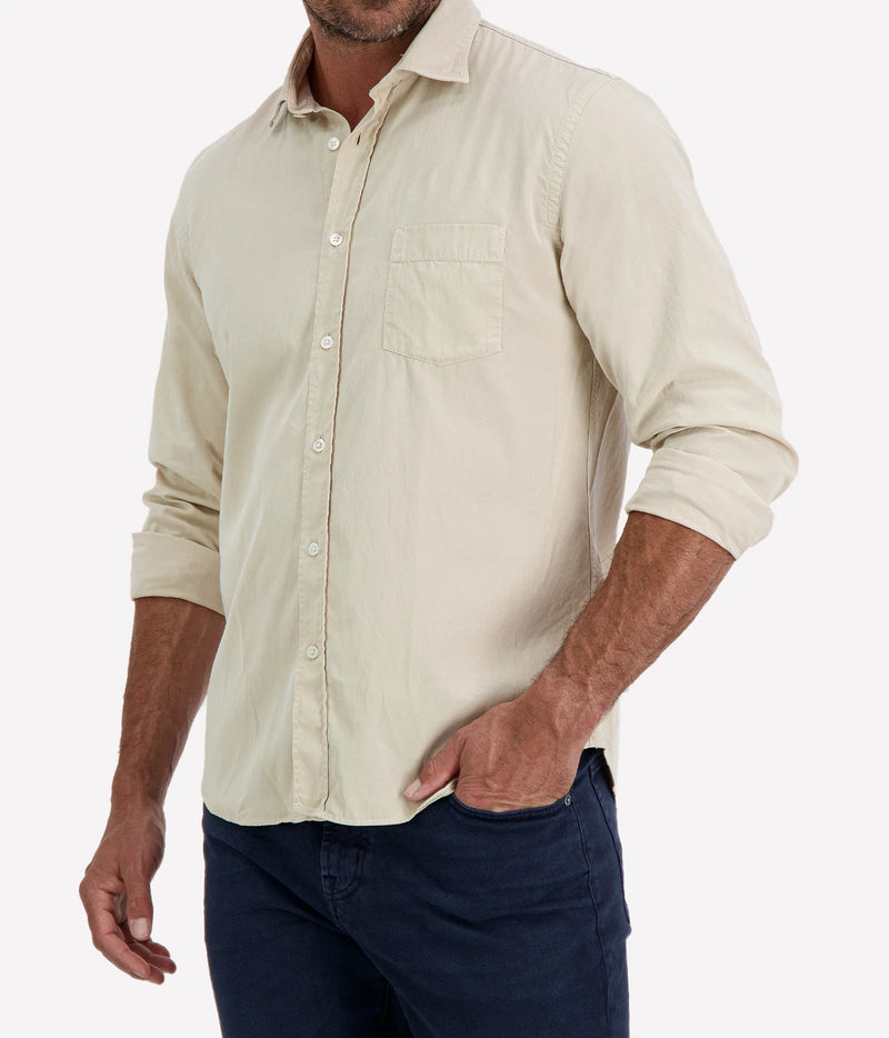 Man wearing Hartford Paul Tencel & Cotton Shirt in Stone with indigo jeans, cropped angled front view with hand in pocket
