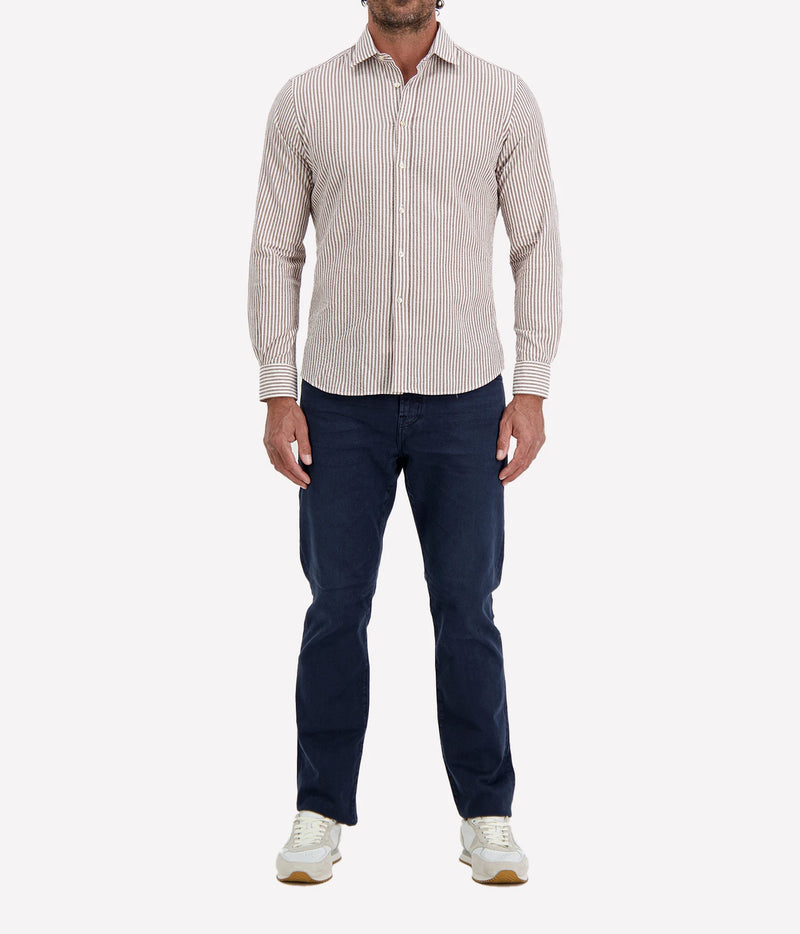Man wearing Ingram Slim Fit Shirt in Seersucker Brown & White Stripe with indigo jeans and white sneakers, full-length front view