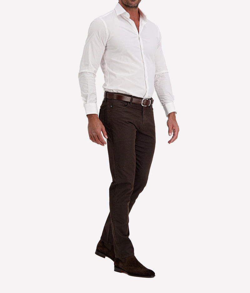Man wearing Ingram Slim Fit Shirt in White with dark brown trousers and dark brown shoes, angled front view