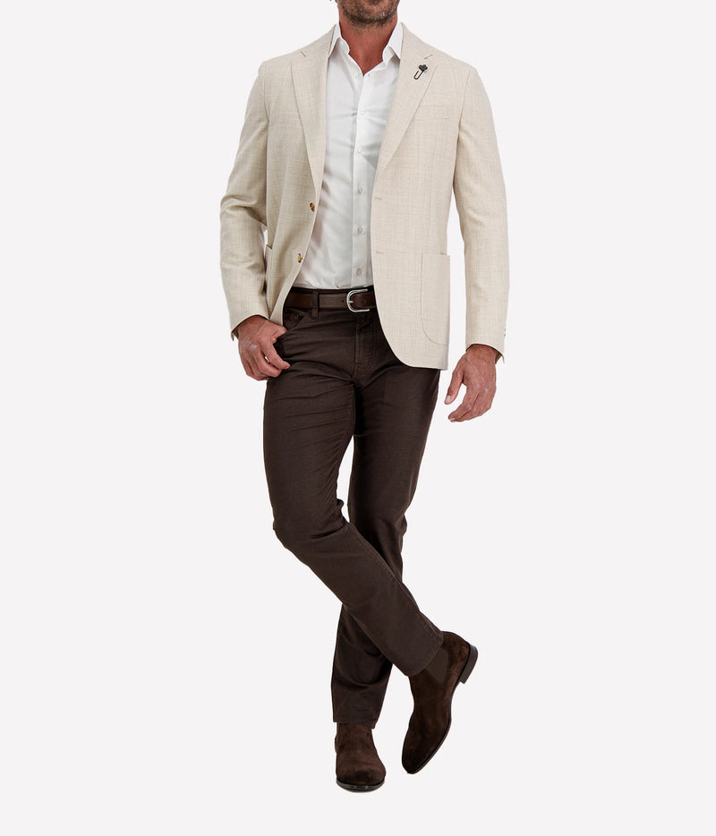 Man wearing Lardini Iconic Jacket in Beige Check with dark brown trousers, three-quarter walking view