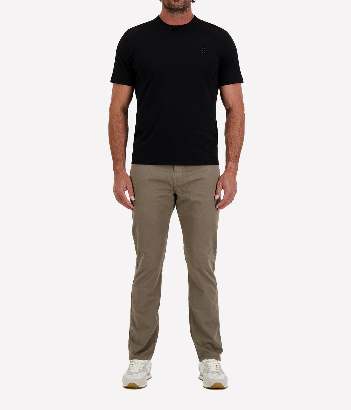 Man wearing Jacob Cohën Girocollo Costina T-Shirt in Black with khaki chinos and white sneakers, full-length front view