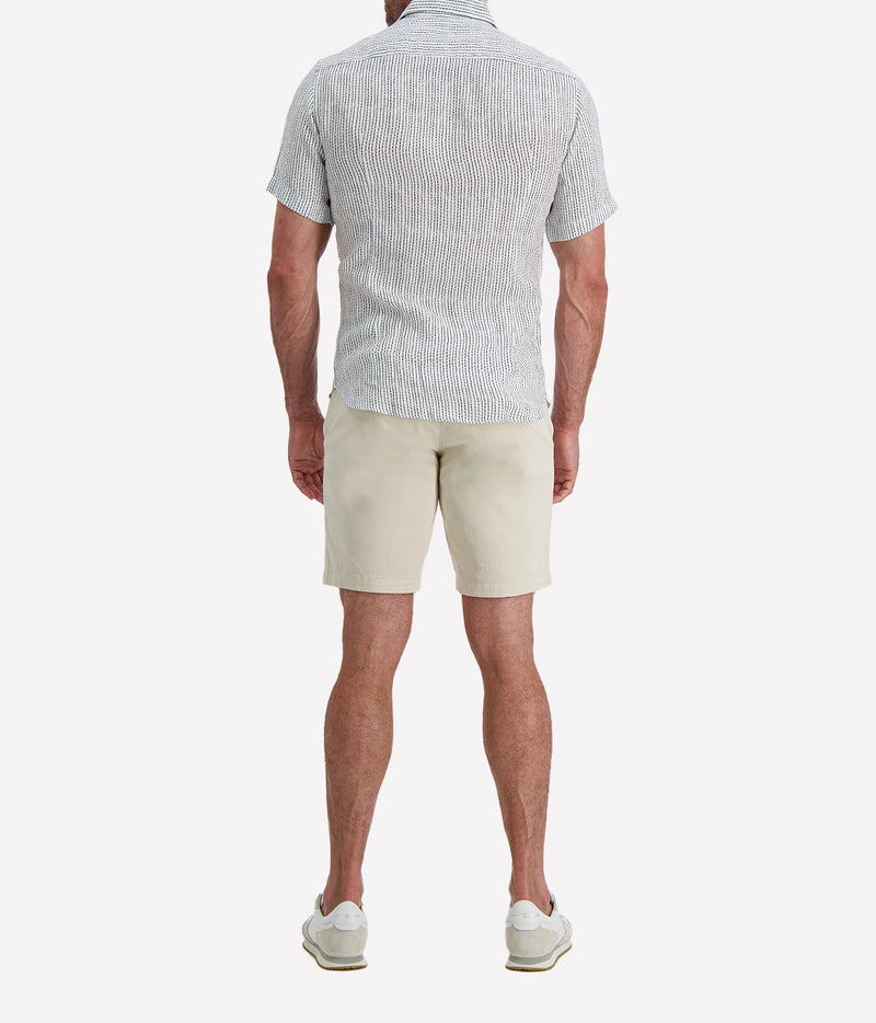 Back view of man wearing Osvaldo Trucchi Linen Short Sleeve Shirt in Navy Woven Stripe with stone shorts