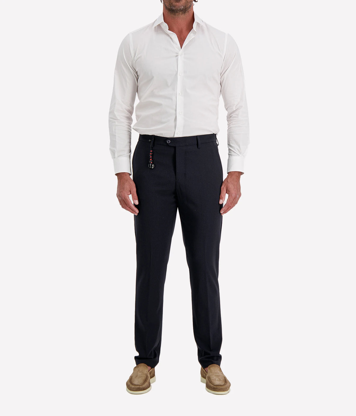 Man wearing Marco Pescarolo Evo Wool Trouser in Navy with a white shirt and tan suede shoes, full-length front view